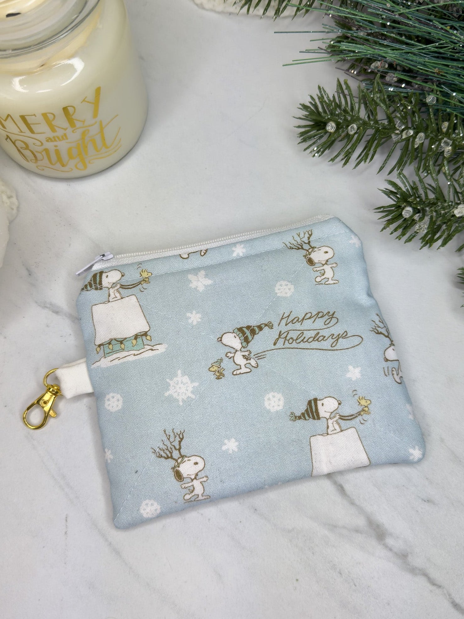 Fabric pouch with Christmas-themed design 