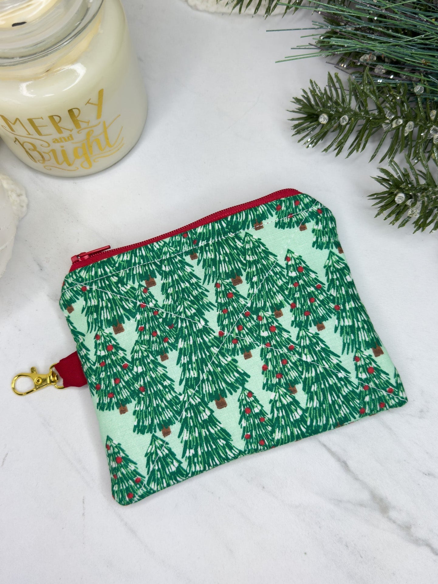Green fabric pouch with Christmas tree pattern 